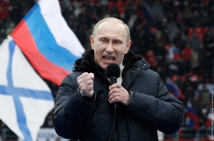 Presidential candidate and Russia's current Prime Minister Putin delivers a speech during a rally to support his candidature in the upcoming presidential election at the Luzhniki stadium on the Defender of the Fatherland Day in Moscow