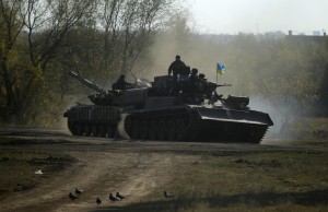 Ukrainian armoured vehicles move along a road near Debaltseve