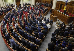 Newly elected parliamentary deputies sing the national anthem during the first session of the new Ukrainian parliament, which was elected in October, in Kiev